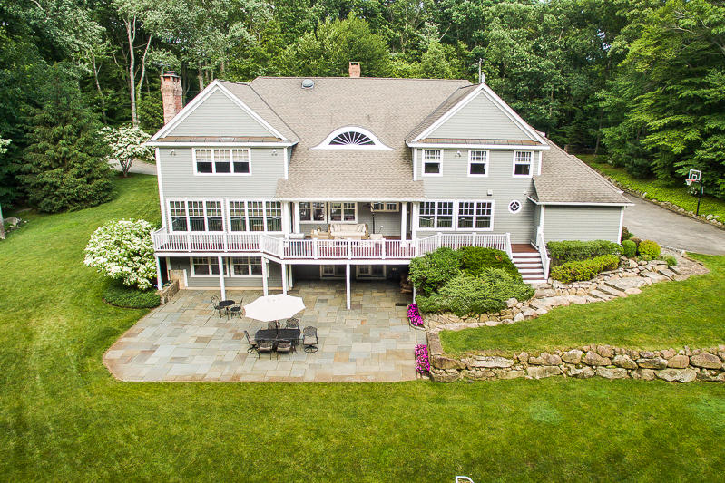 786 Cheese Spring Road New Canaan, CT 06840 - Photo 35 of 36 a view of a house with a yard and potted plants