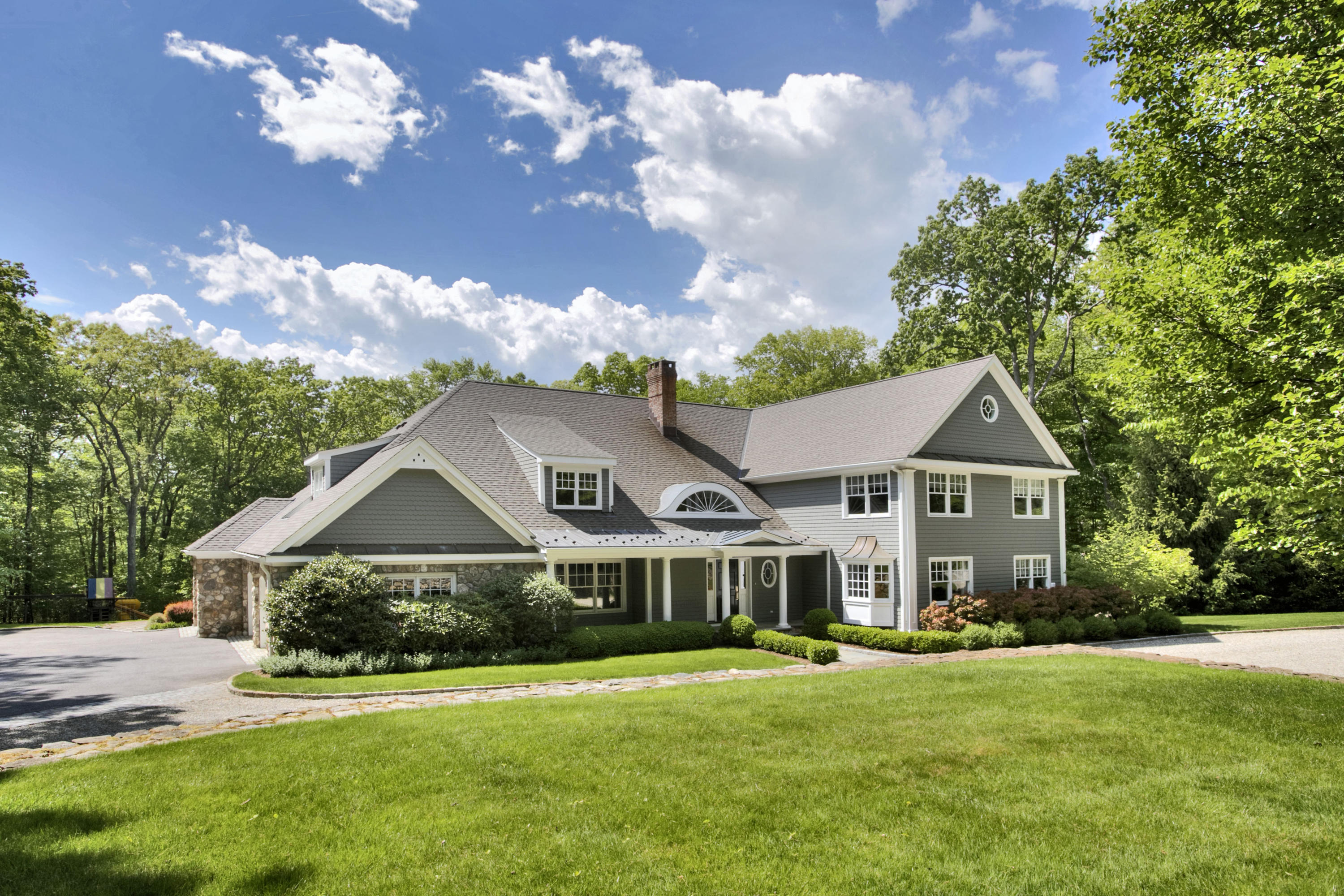 786 Cheese Spring Road New Canaan, CT 06840 - Photo 36 of 36 a front view of a house with a garden