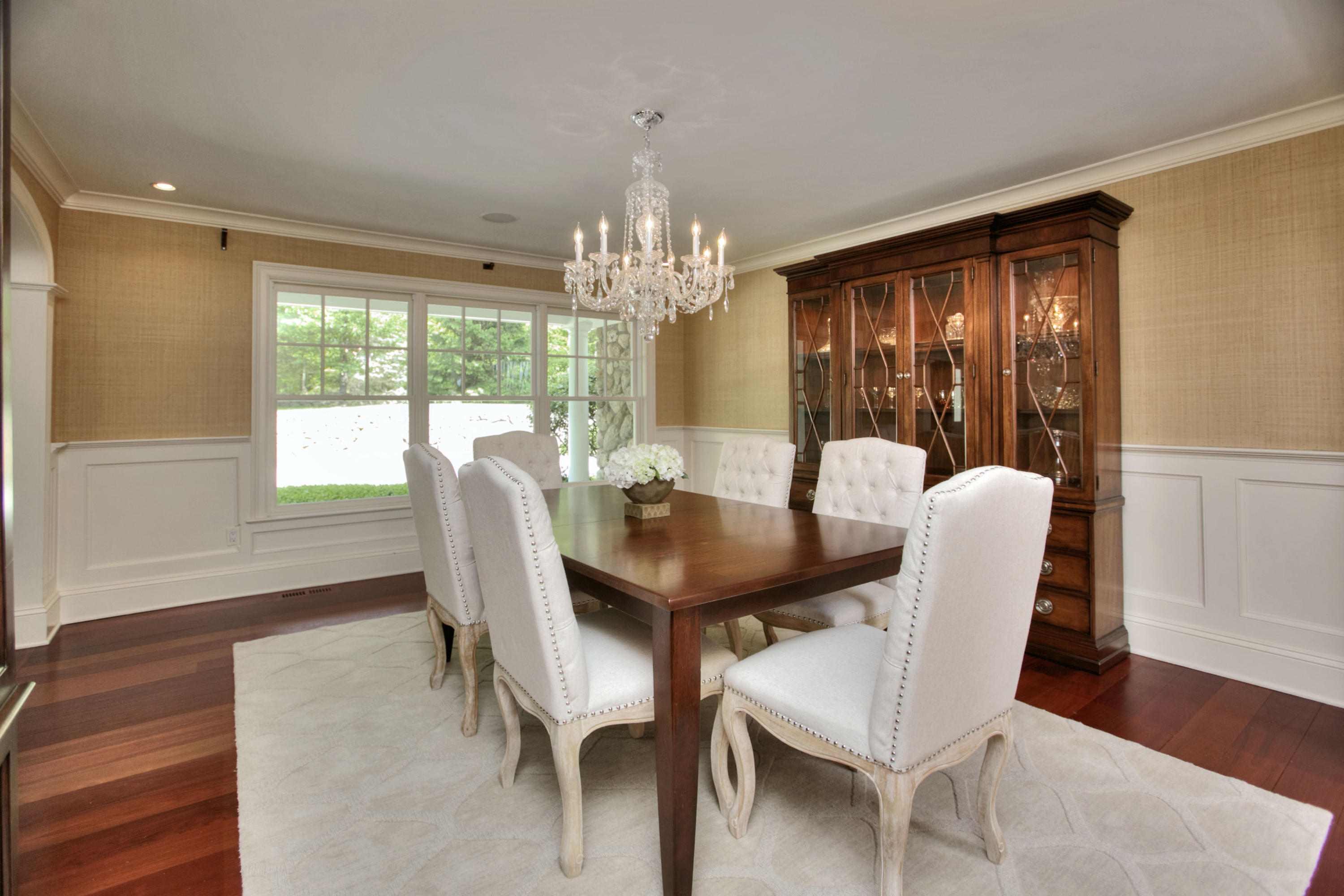 786 Cheese Spring Road New Canaan, CT 06840 - Photo 9 of 36 a view of a dining room with furniture wooden floor and chandelier