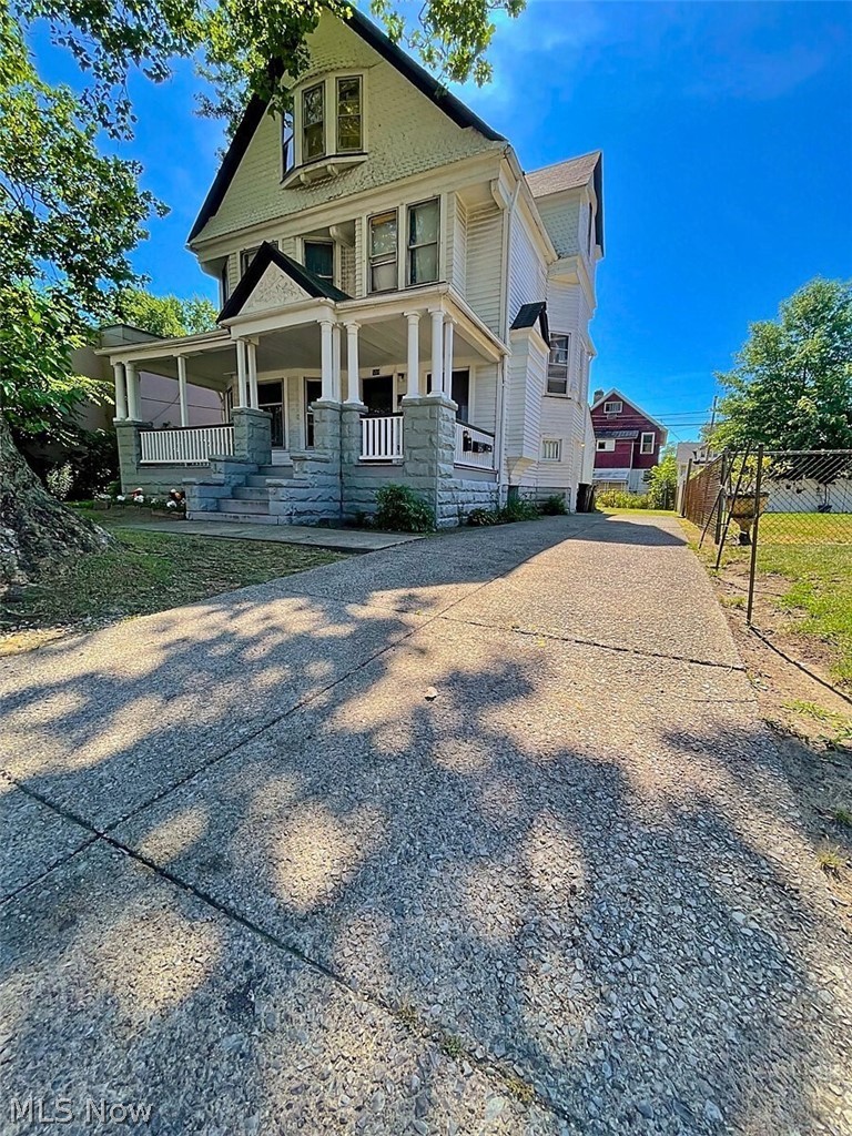 554 Eddy Road Cleveland, OH 44108 - Photo 3 of 32 Victorian home featuring covered porch and driveway