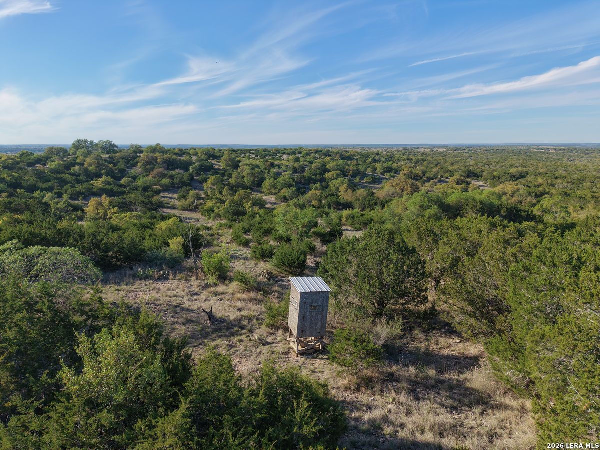 870 Rocky Top Road Southwest Hunt, TX 78024 - Photo 15 of 28 an aerial view of a house with a yard