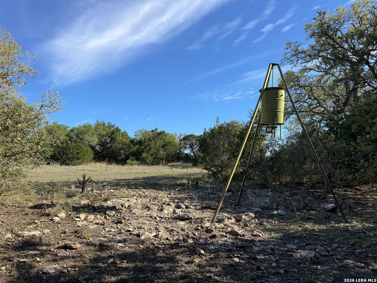 870 Rocky Top Road Southwest Hunt, TX 78024 - Photo 10 of 28 a backyard of a house with a yard