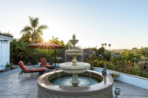 a view of a backyard with sitting area