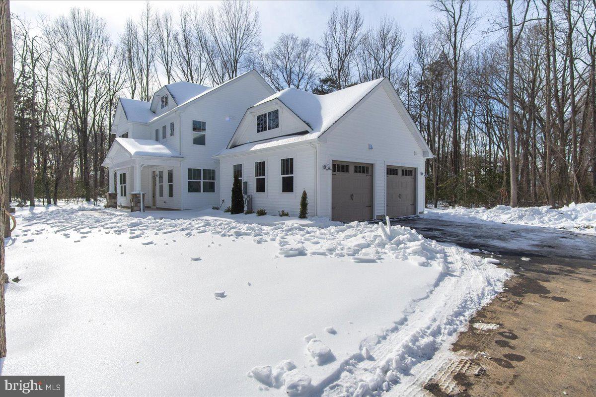 1379 Mc Donald Road Shady Side, MD 20764 - Photo 54 of 55 a view of a white house with a yard covered in snow