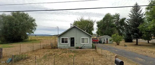 a view of a house with a street