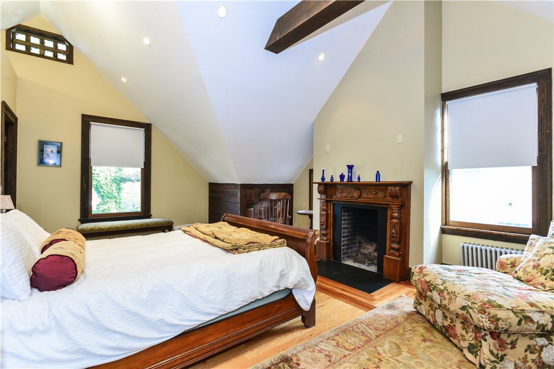 80 Kay Street Newport, RI 02840 - Photo 22 of 39 Beautiful bedroom with exposed beams, fireplace, and gorgeous en-suite bathroom.