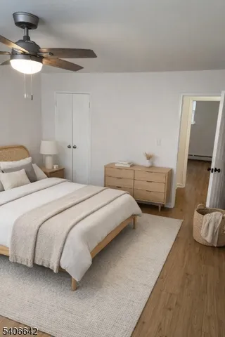 a bedroom with bed and a chandelier