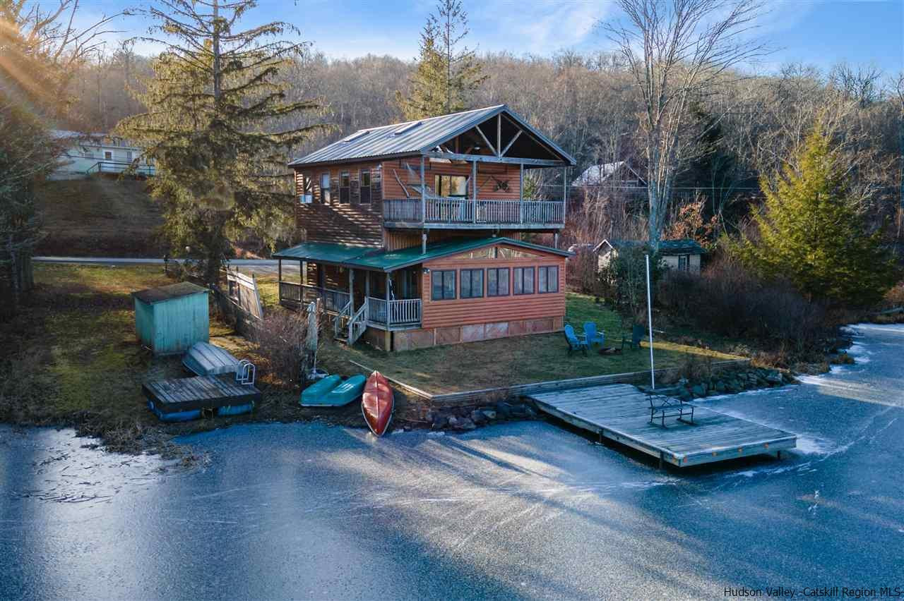 212 Trout Brook Road Roscoe, NY 12776 - Photo 1 of 35 a front view of a house with garden