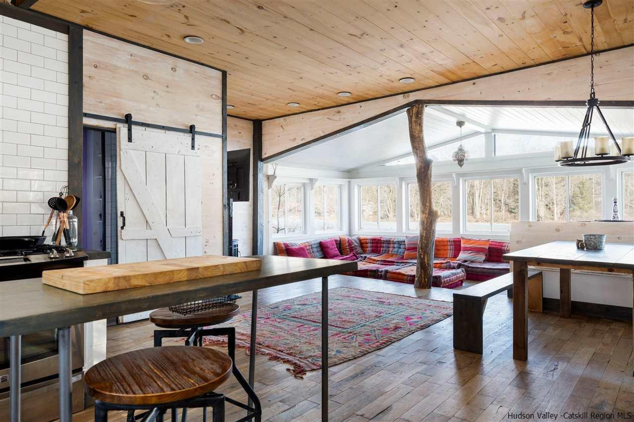 212 Trout Brook Road Roscoe, NY 12776 - Photo 11 of 35 a room with lots of furniture and window