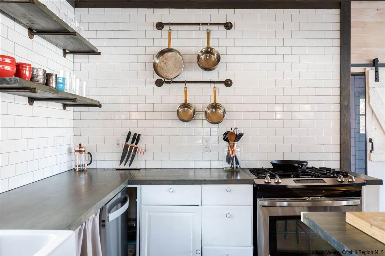 212 Trout Brook Road Roscoe, NY 12776 - Photo 12 of 35 a kitchen with a stove and a sink