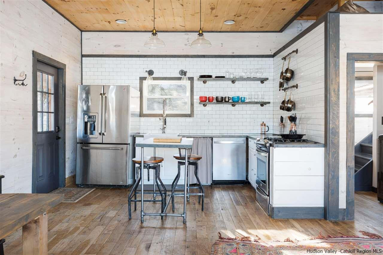 212 Trout Brook Road Roscoe, NY 12776 - Photo 14 of 35 a kitchen with a refrigerator and white appliances