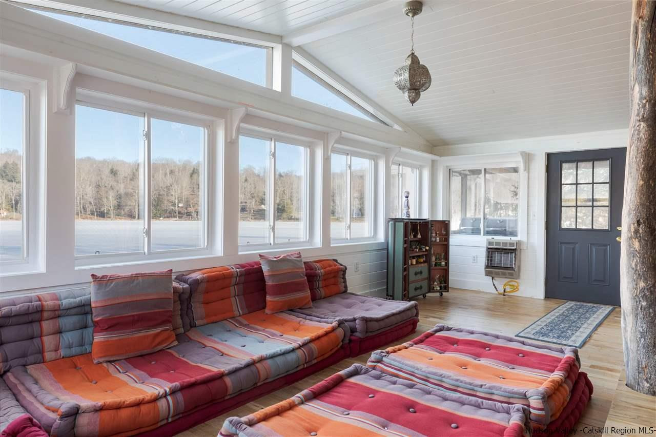 212 Trout Brook Road Roscoe, NY 12776 - Photo 18 of 35 a living room with furniture and a window