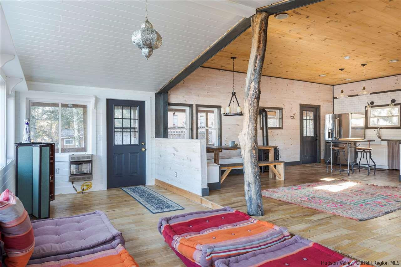 212 Trout Brook Road Roscoe, NY 12776 - Photo 20 of 35 a living room with furniture and wooden floor