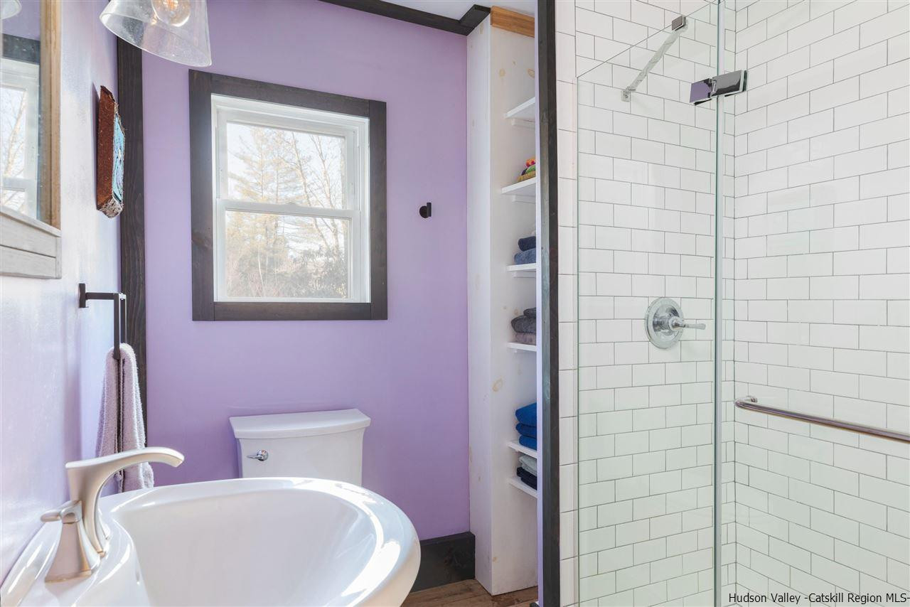 212 Trout Brook Road Roscoe, NY 12776 - Photo 21 of 35 a white toilet sitting next to a bathroom sink