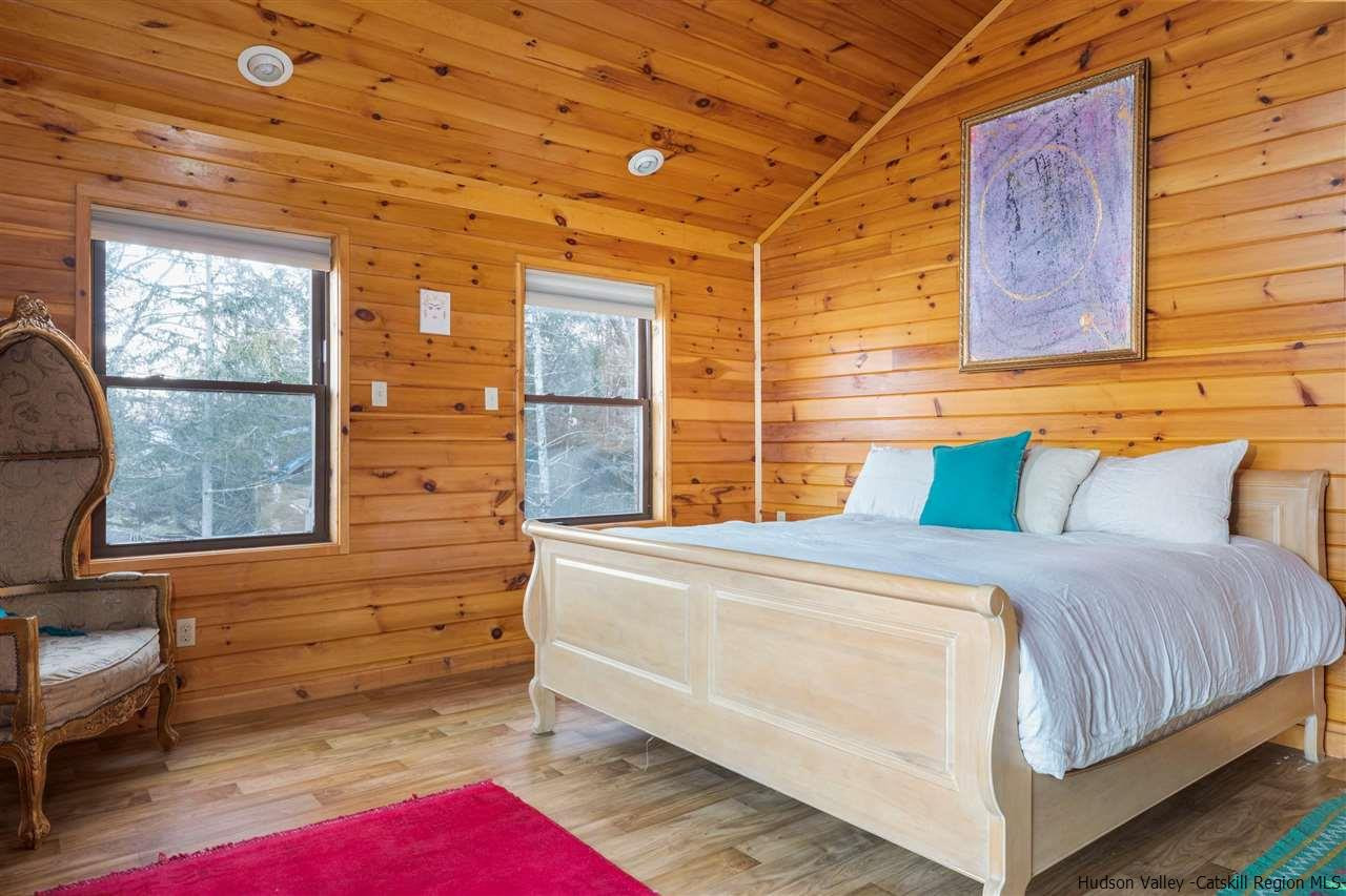 212 Trout Brook Road Roscoe, NY 12776 - Photo 22 of 35 a bed room with a bed and a window