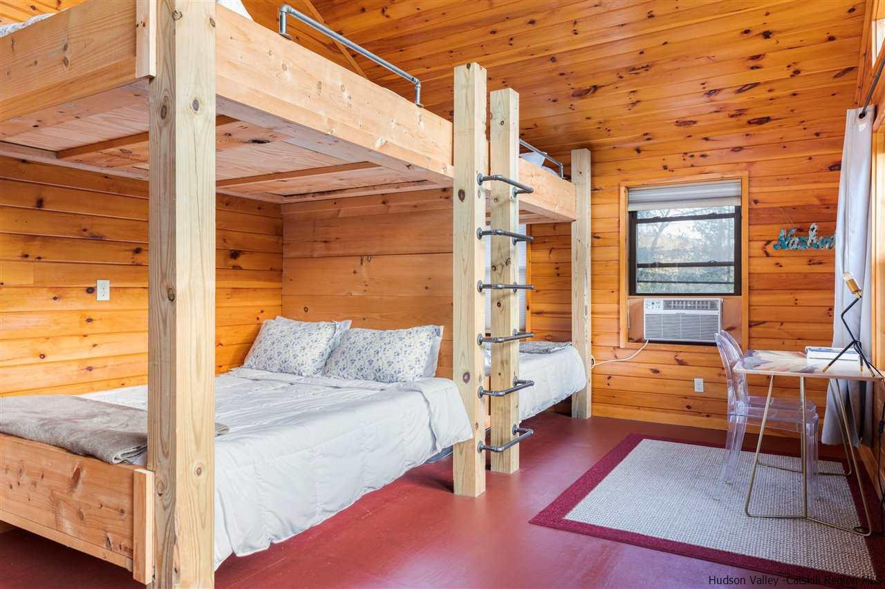 212 Trout Brook Road Roscoe, NY 12776 - Photo 27 of 35 a view of walk in closet with clothes and shoes