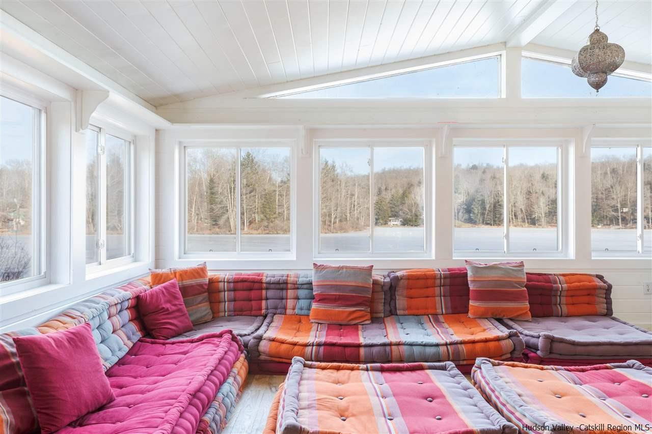 212 Trout Brook Road Roscoe, NY 12776 - Photo 3 of 35 a living room with furniture and large windows