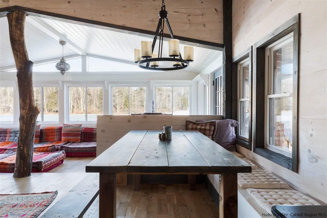 212 Trout Brook Road Roscoe, NY 12776 - Photo 5 of 35 a view of a dining room with furniture window and wooden floor
