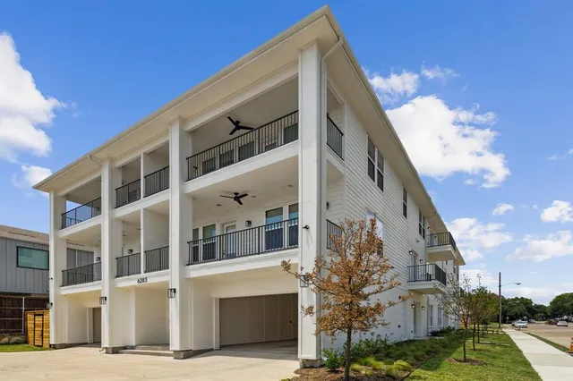 a view of a building with a yard
