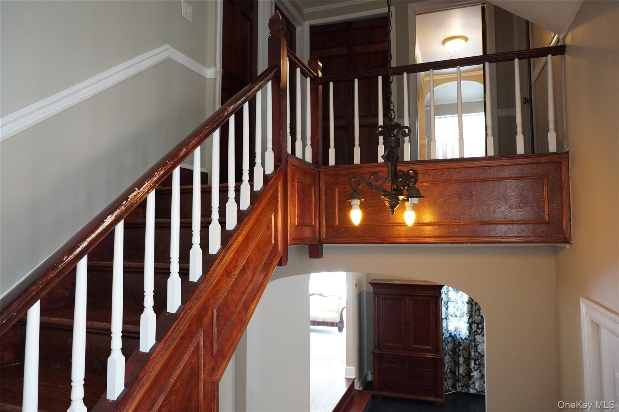 21 Potter Street Patchogue, NY 11772 - Photo 14 of 22 a view of staircase with railing and a window
