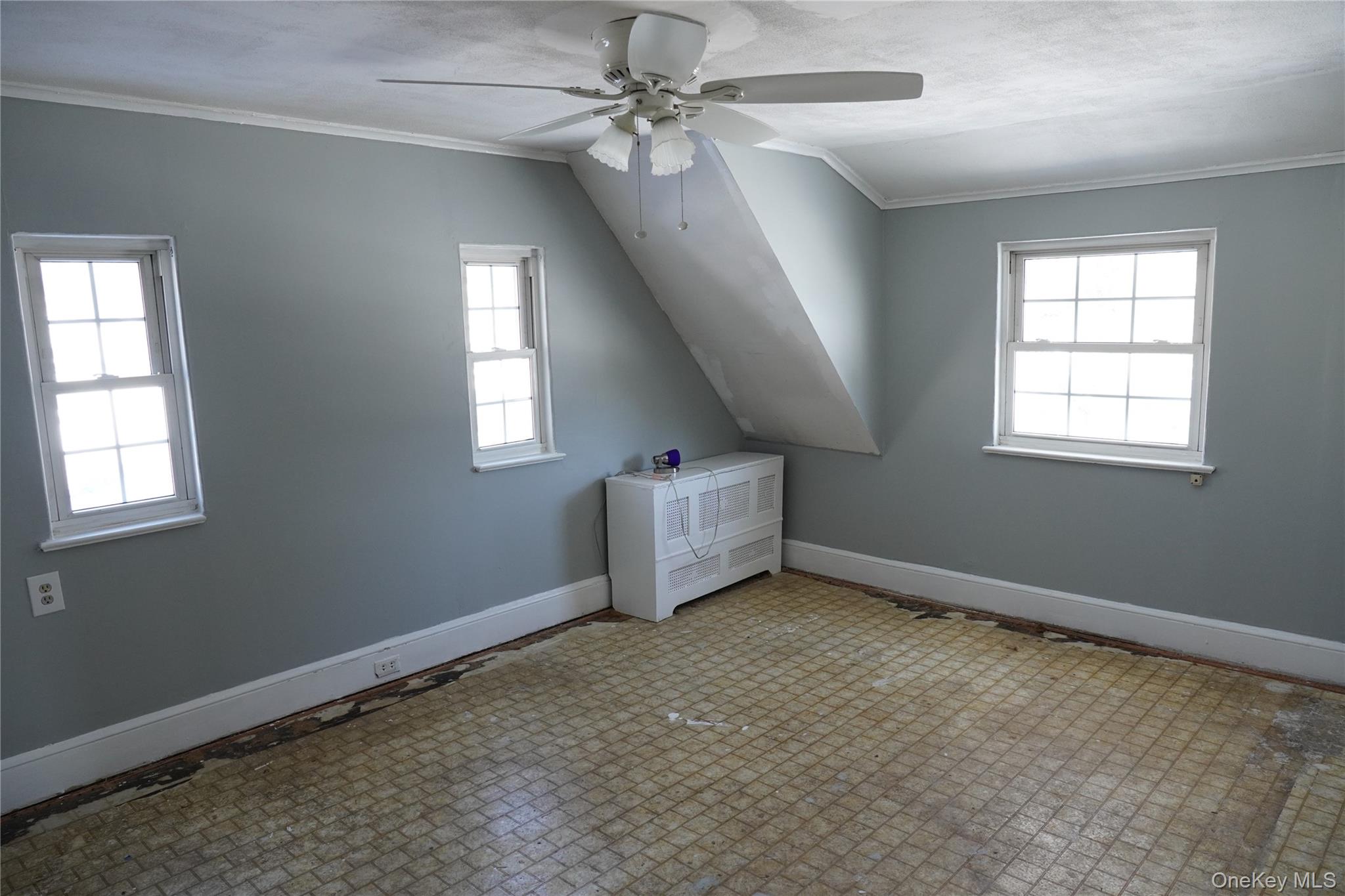 21 Potter Street Patchogue, NY 11772 - Photo 16 of 22 wooden floor in an empty room with a window