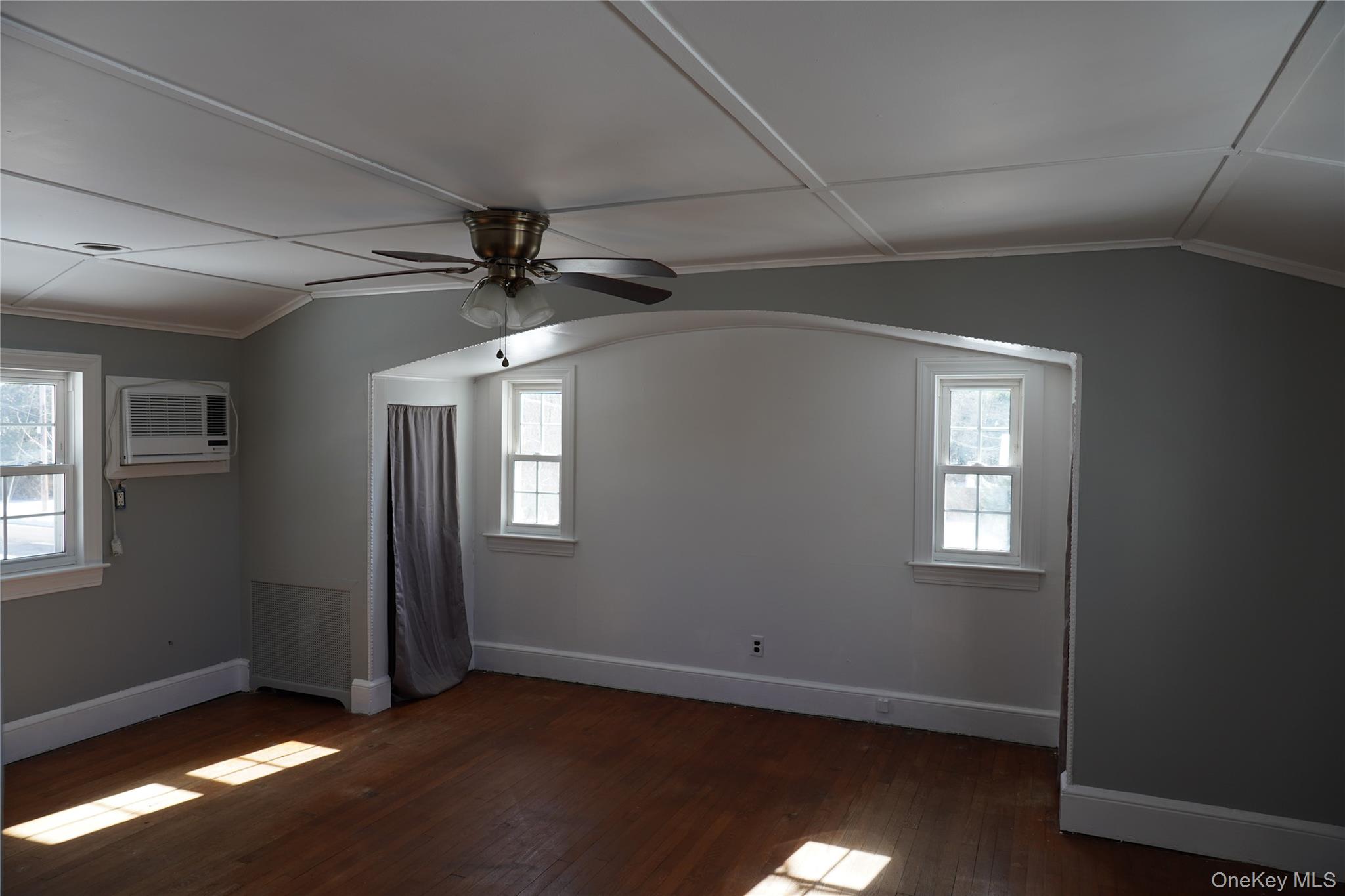 21 Potter Street Patchogue, NY 11772 - Photo 20 of 22 an empty room with windows and fan