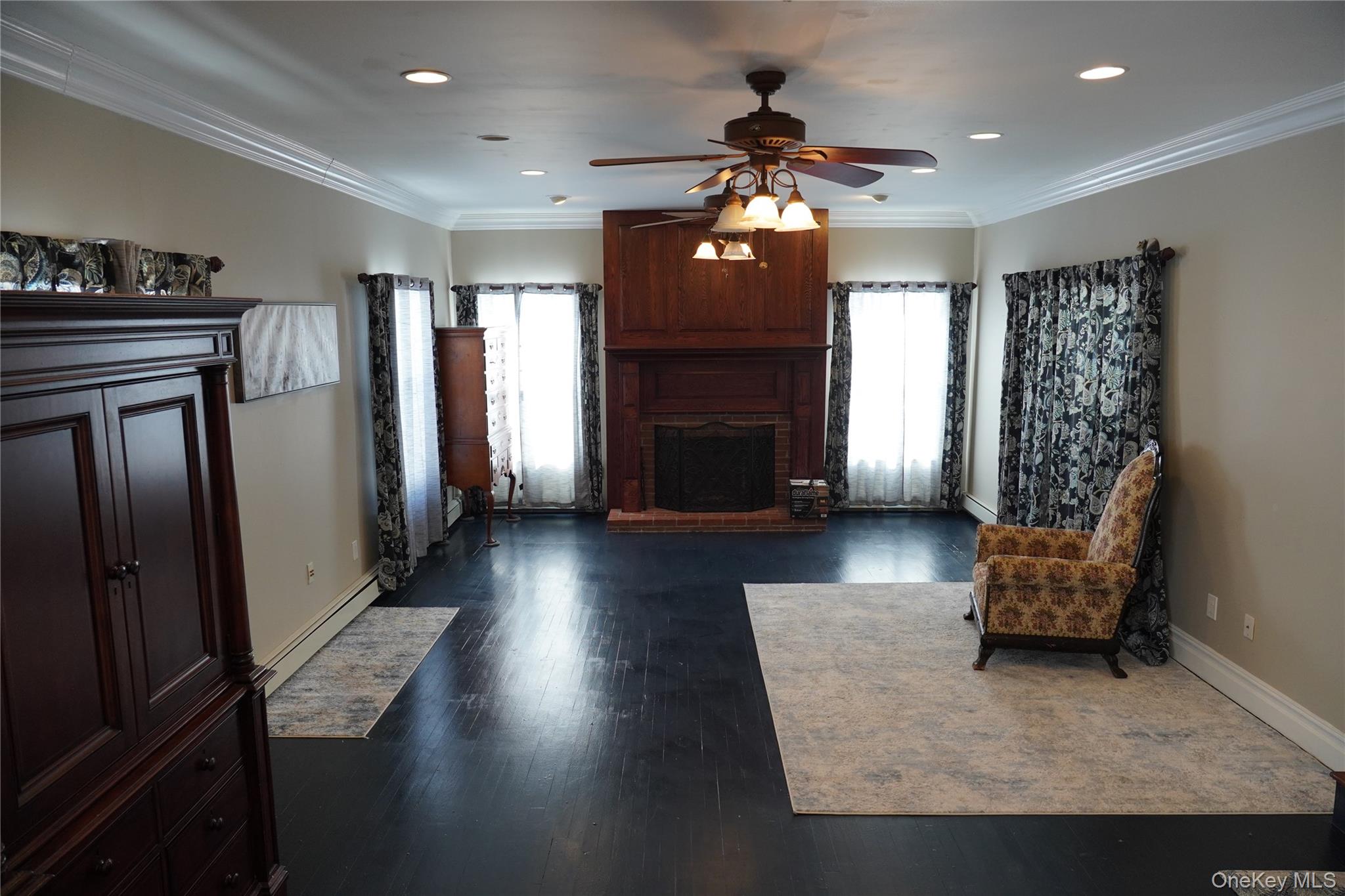 21 Potter Street Patchogue, NY 11772 - Photo 5 of 22 a view of livingroom with furniture and a fireplace