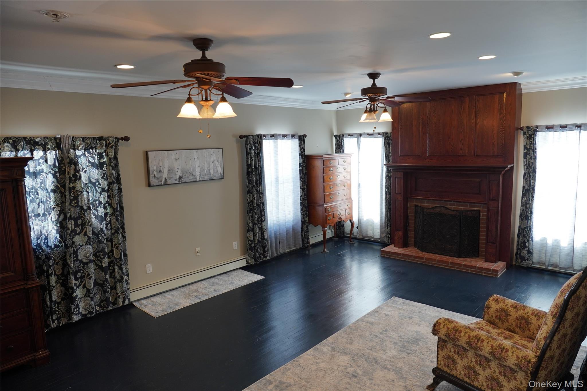 21 Potter Street Patchogue, NY 11772 - Photo 6 of 22 a living room with furniture and a fireplace