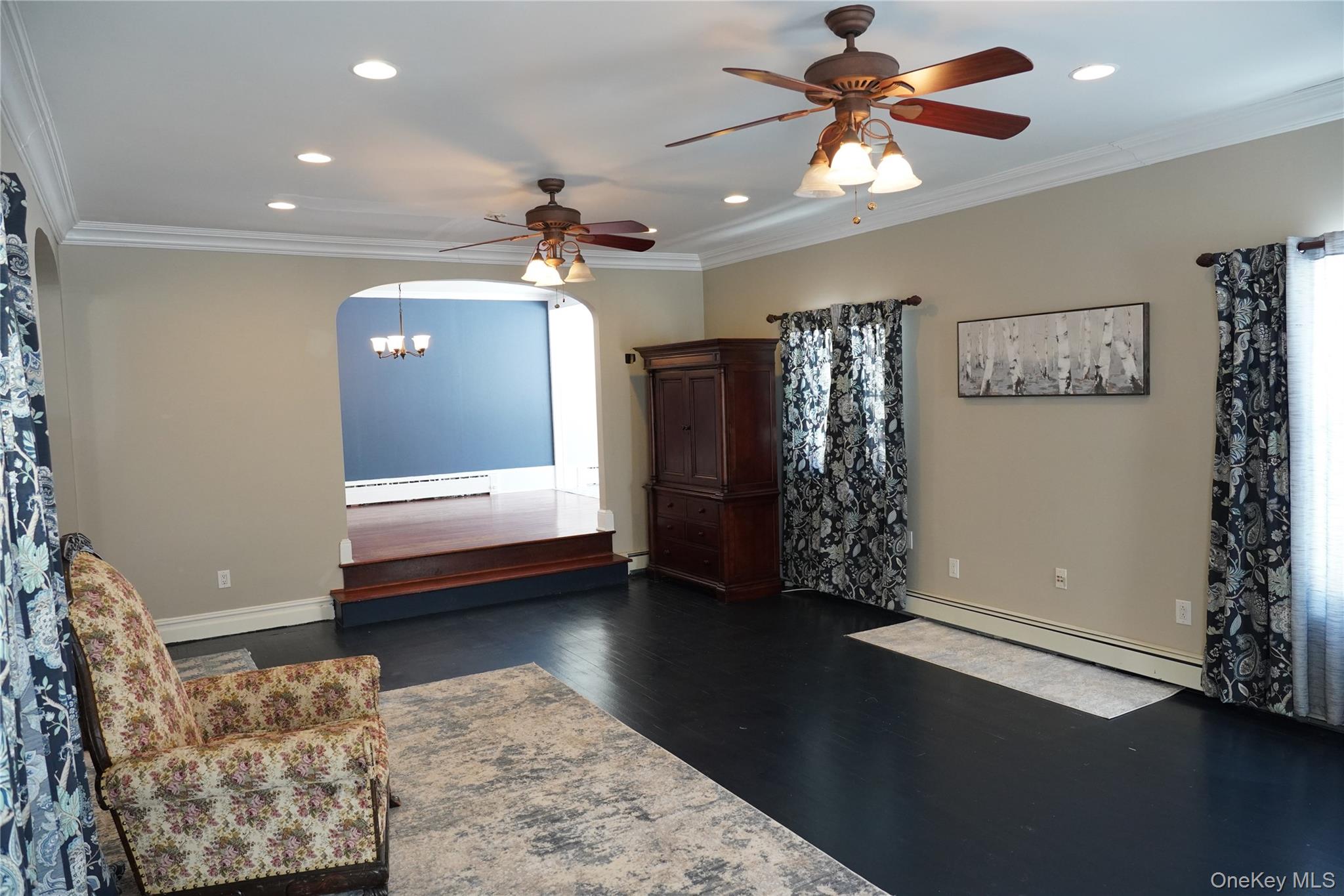21 Potter Street Patchogue, NY 11772 - Photo 7 of 22 a view of livingroom with furniture and chandelier fan
