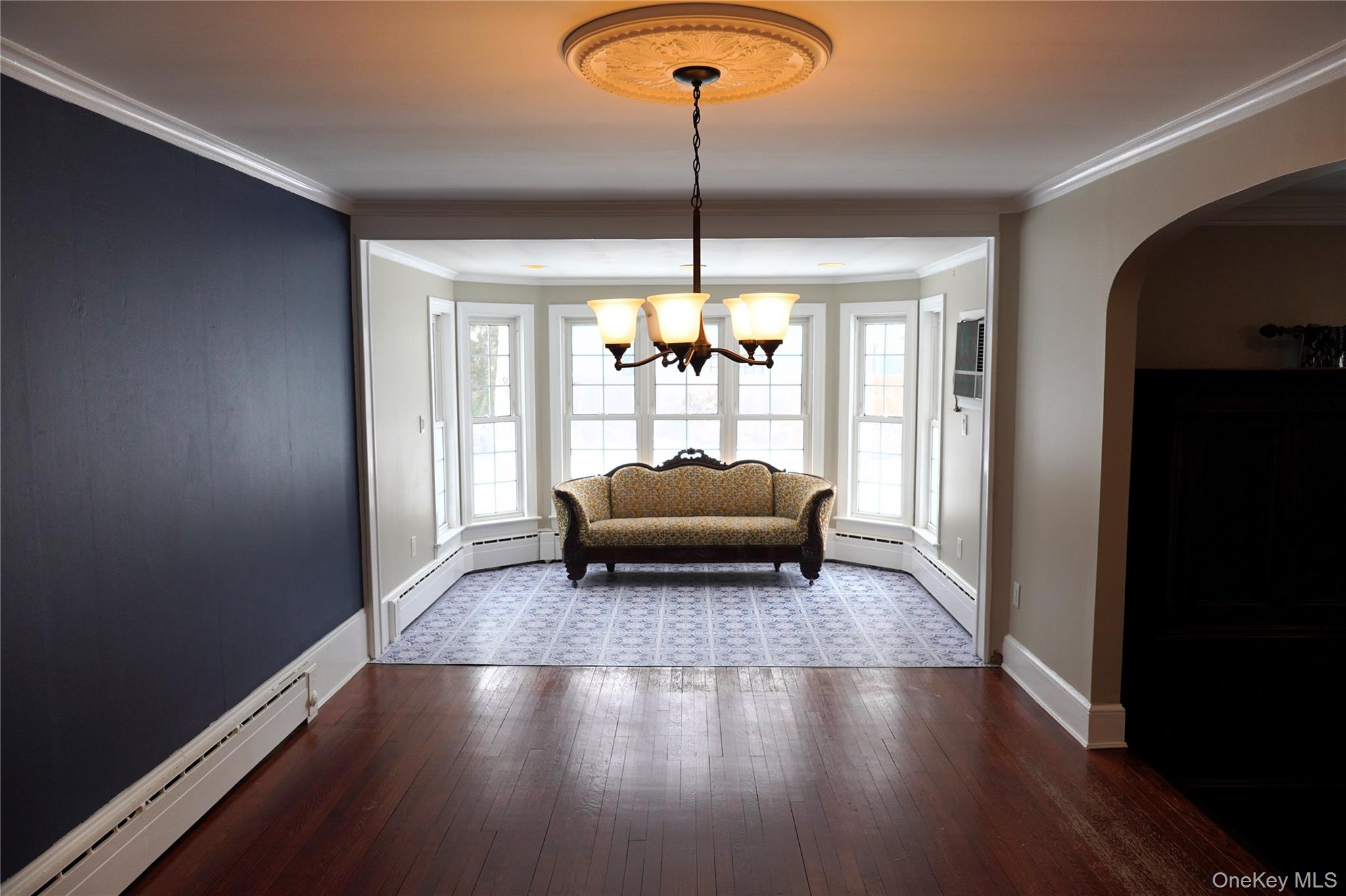 21 Potter Street Patchogue, NY 11772 - Photo 8 of 22 a living room with furniture and a large window
