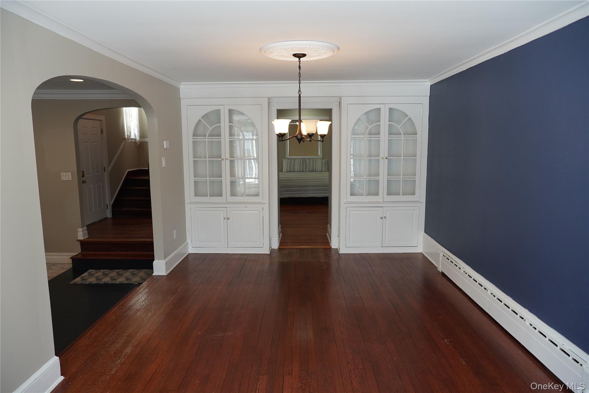 21 Potter Street Patchogue, NY 11772 - Photo 9 of 22 wooden floor in an empty room with a window