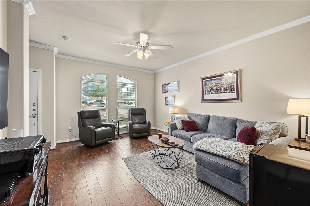 1198 Jones-Butler Road, Unit 2505 College Station, TX 77840 - Photo 3 of 13 a living room with furniture and a wooden floor