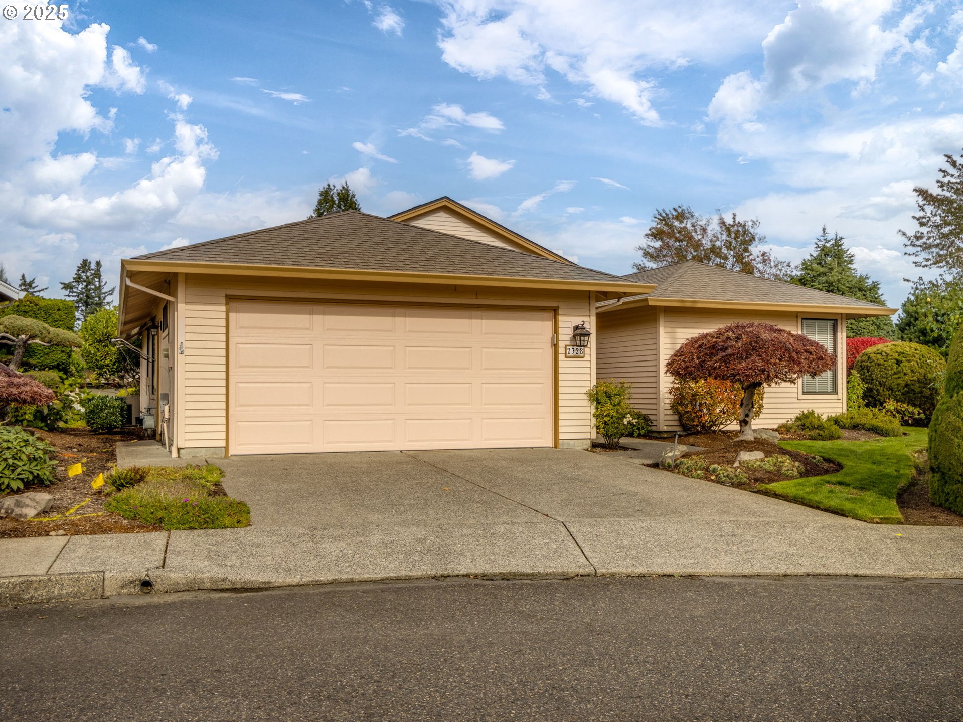 2328 Northeast 156th Place Portland, OR 97230 - Photo 1 of 41 a front view of a house with a yard and garage