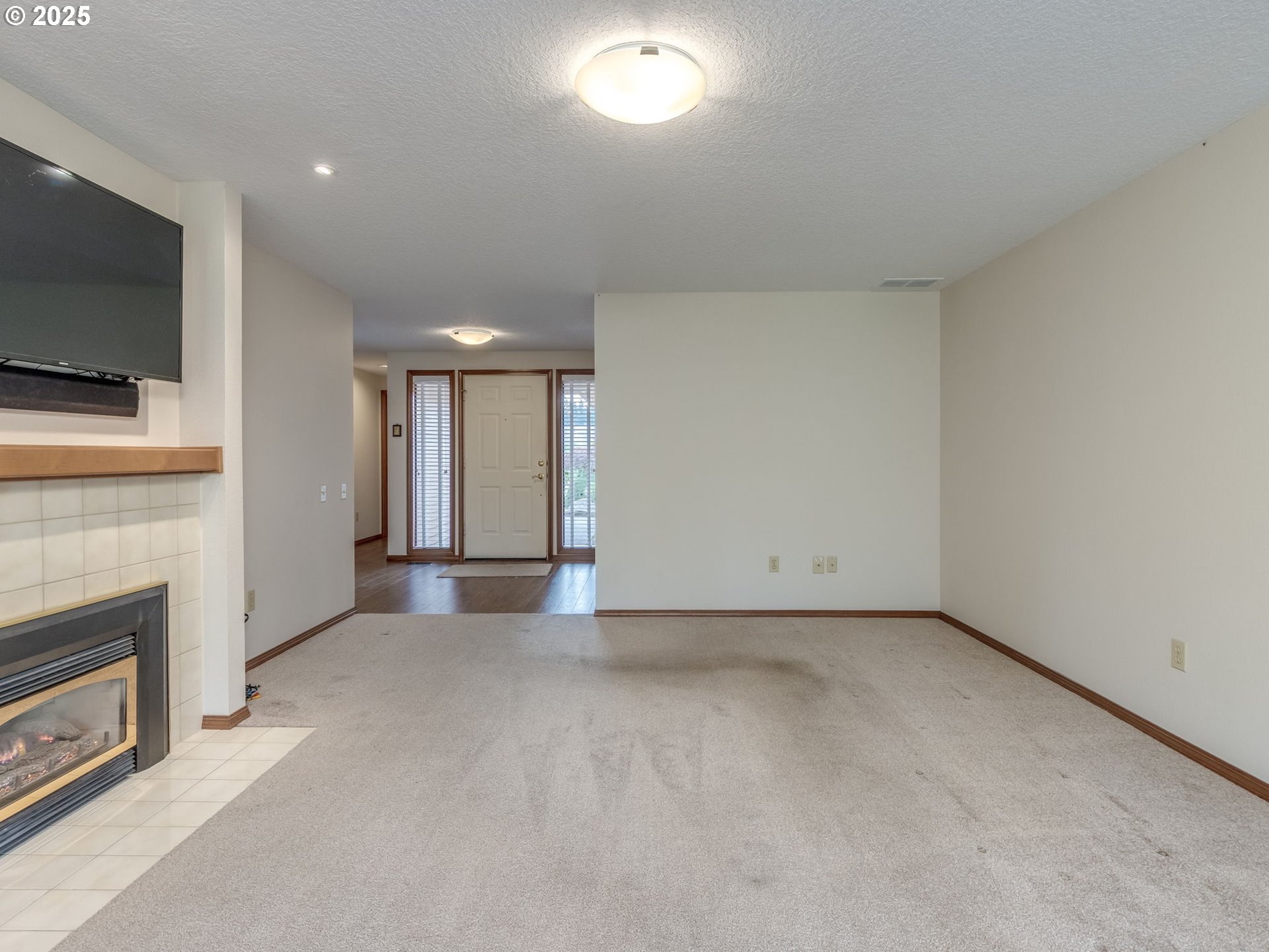 2328 Northeast 156th Place Portland, OR 97230 - Photo 11 of 41 a view of an empty room with a fireplace