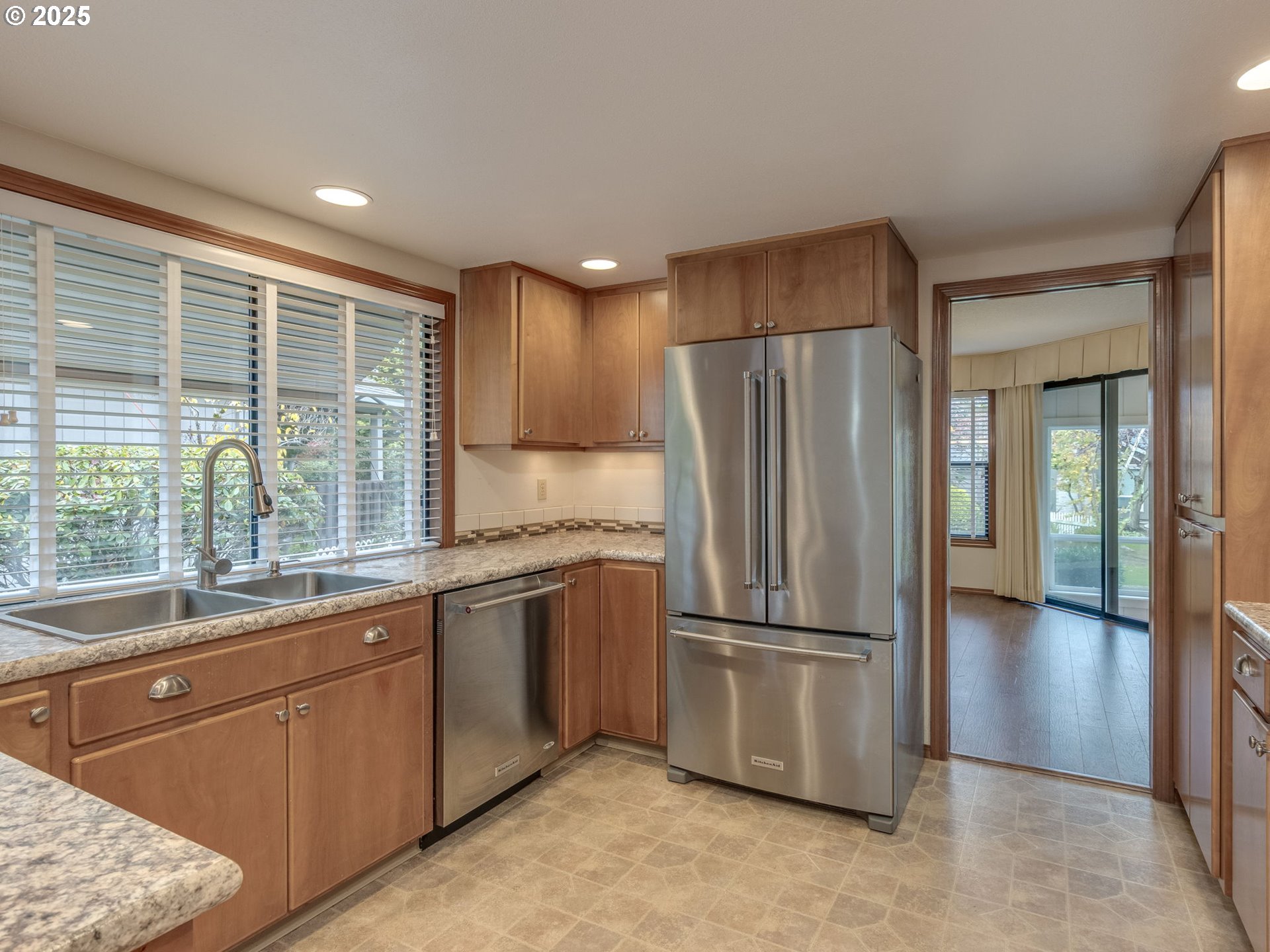 2328 Northeast 156th Place Portland, OR 97230 - Photo 16 of 41 a kitchen with stainless steel appliances granite countertop a refrigerator and a sink