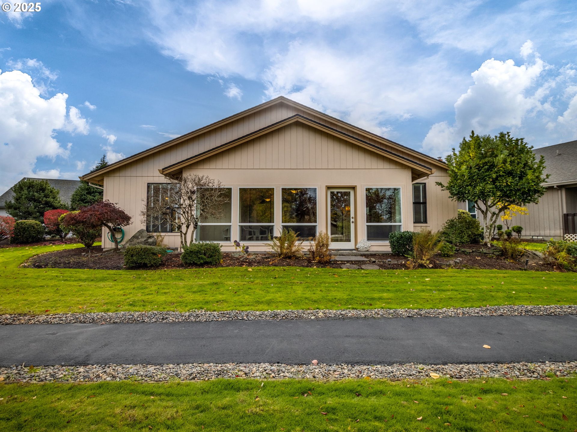 2328 Northeast 156th Place Portland, OR 97230 - Photo 35 of 41 a front view of a house with a garden and yard