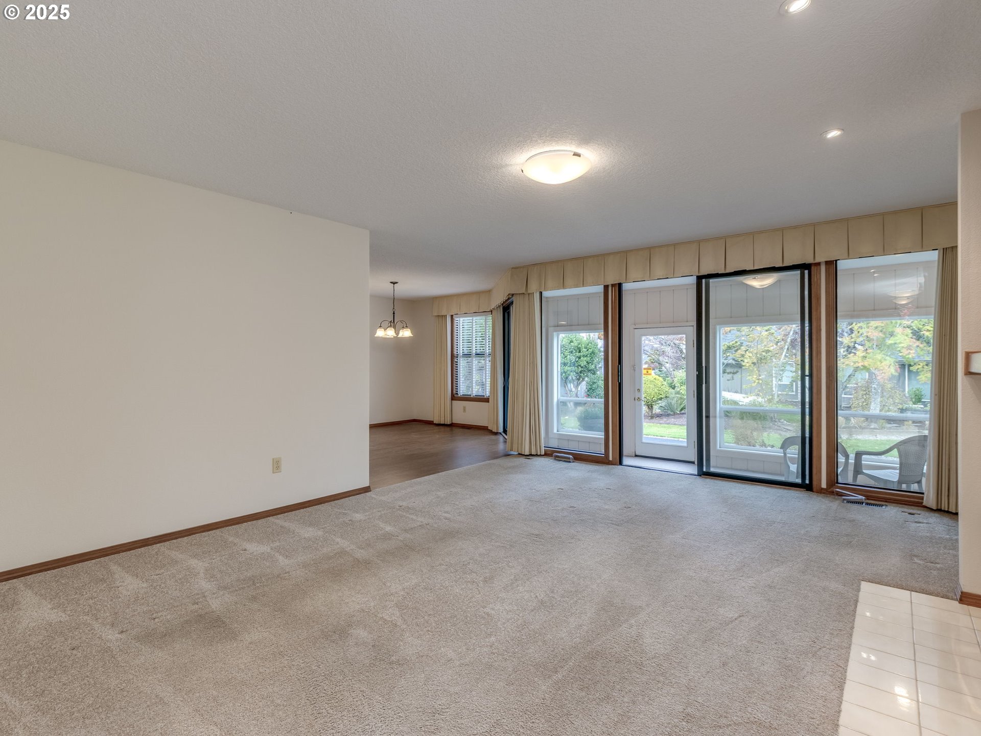 2328 Northeast 156th Place Portland, OR 97230 - Photo 7 of 41 wooden floor in an empty room with a large window