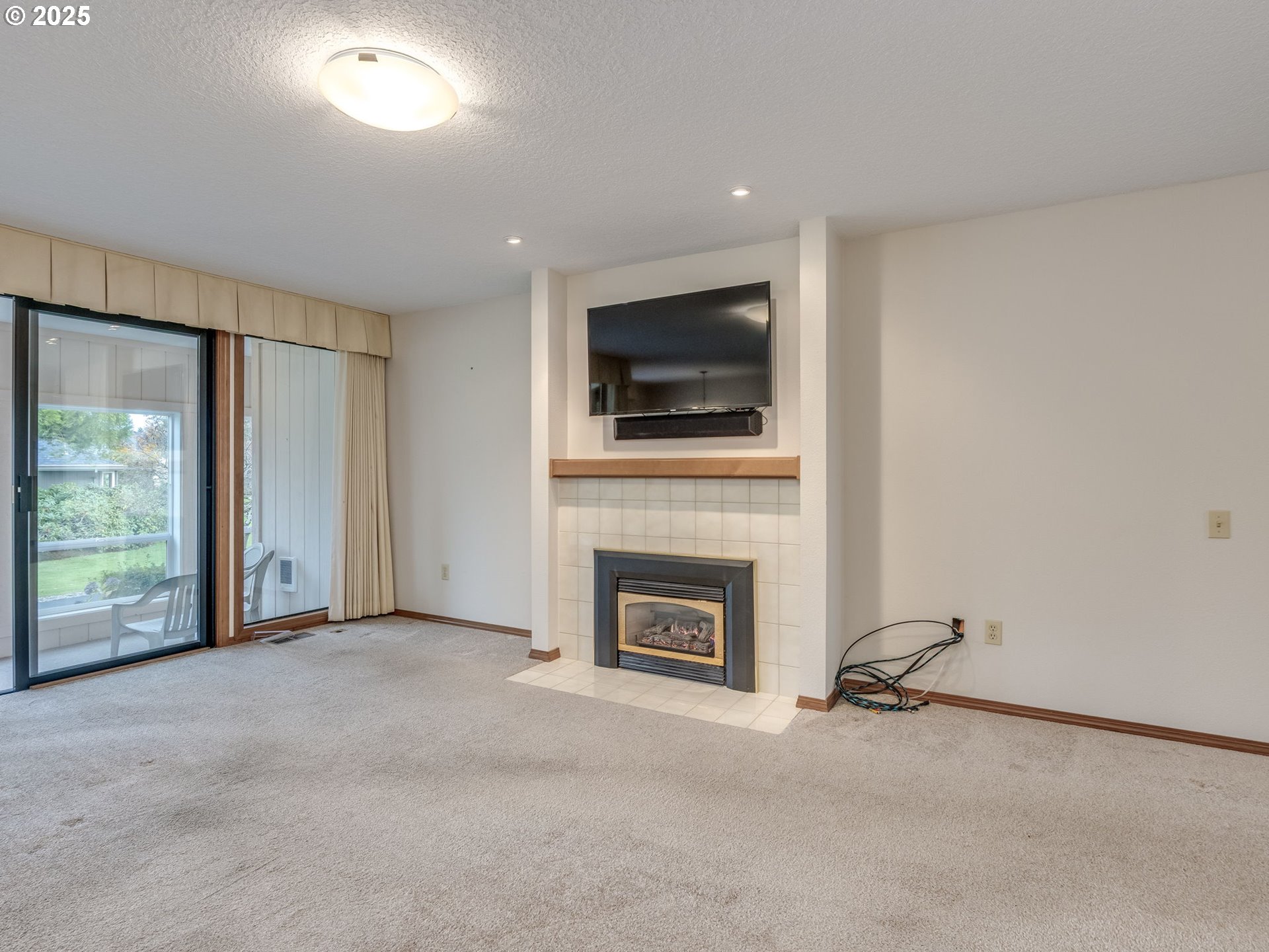 2328 Northeast 156th Place Portland, OR 97230 - Photo 9 of 41 a view of an empty room with a fireplace