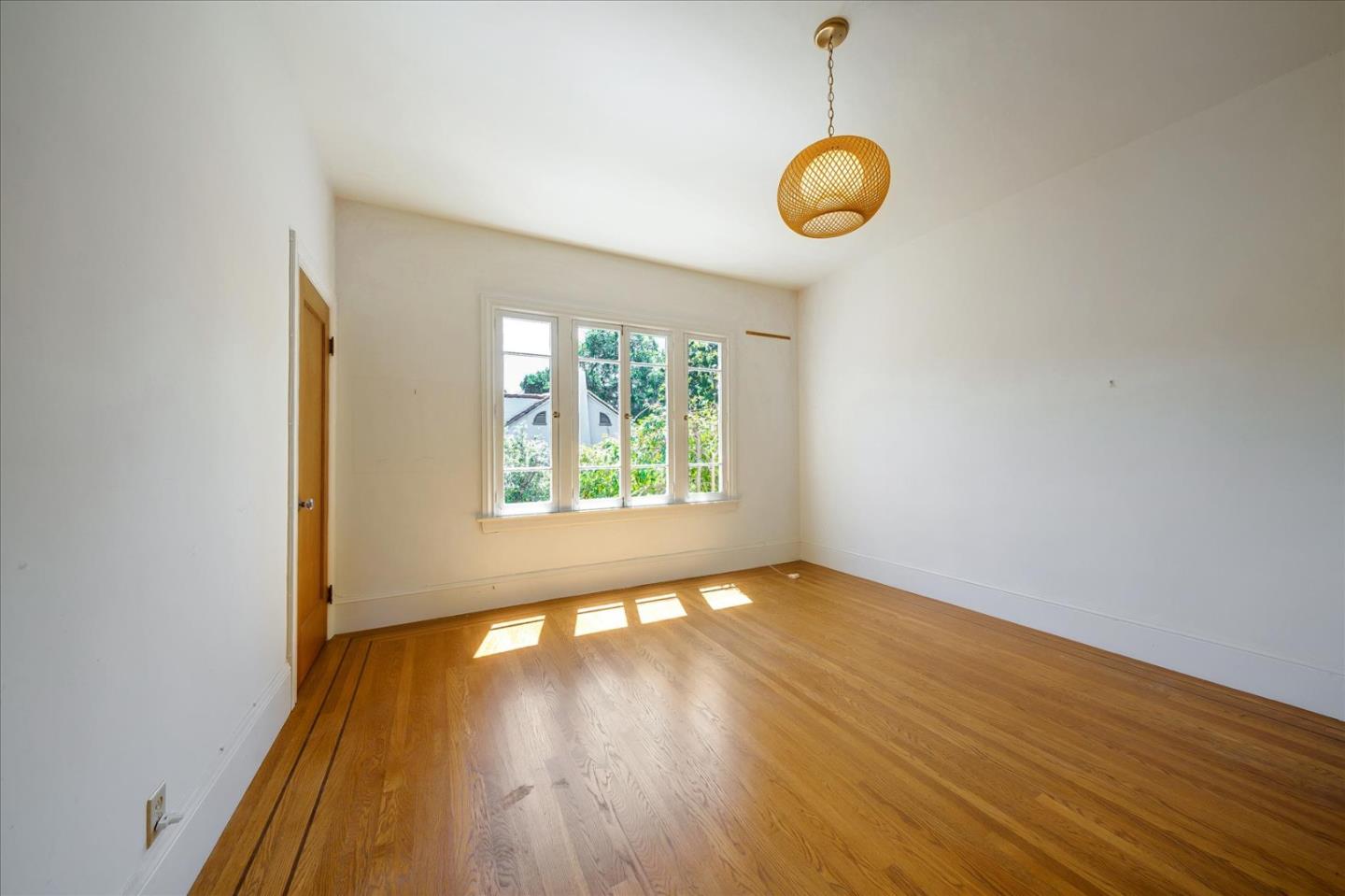 167 Almendral Avenue Atherton, CA 94027 - Photo 12 of 50 an empty room with wooden floor and windows