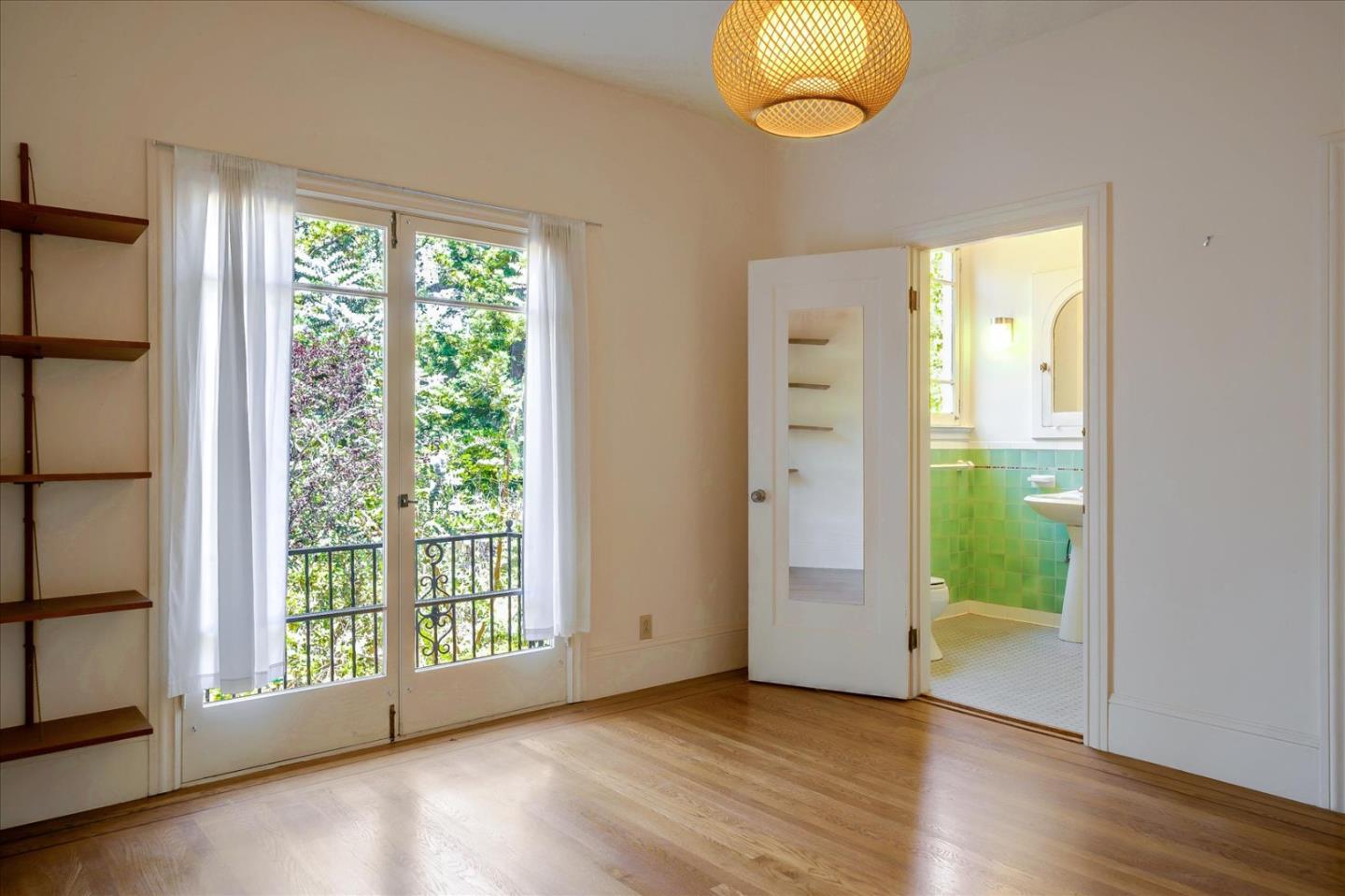 167 Almendral Avenue Atherton, CA 94027 - Photo 15 of 50 a view of an empty room with wooden floor and a window