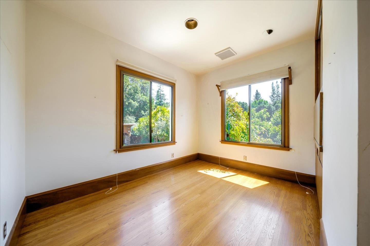 167 Almendral Avenue Atherton, CA 94027 - Photo 16 of 50 a view of an empty room with wooden floor and a window