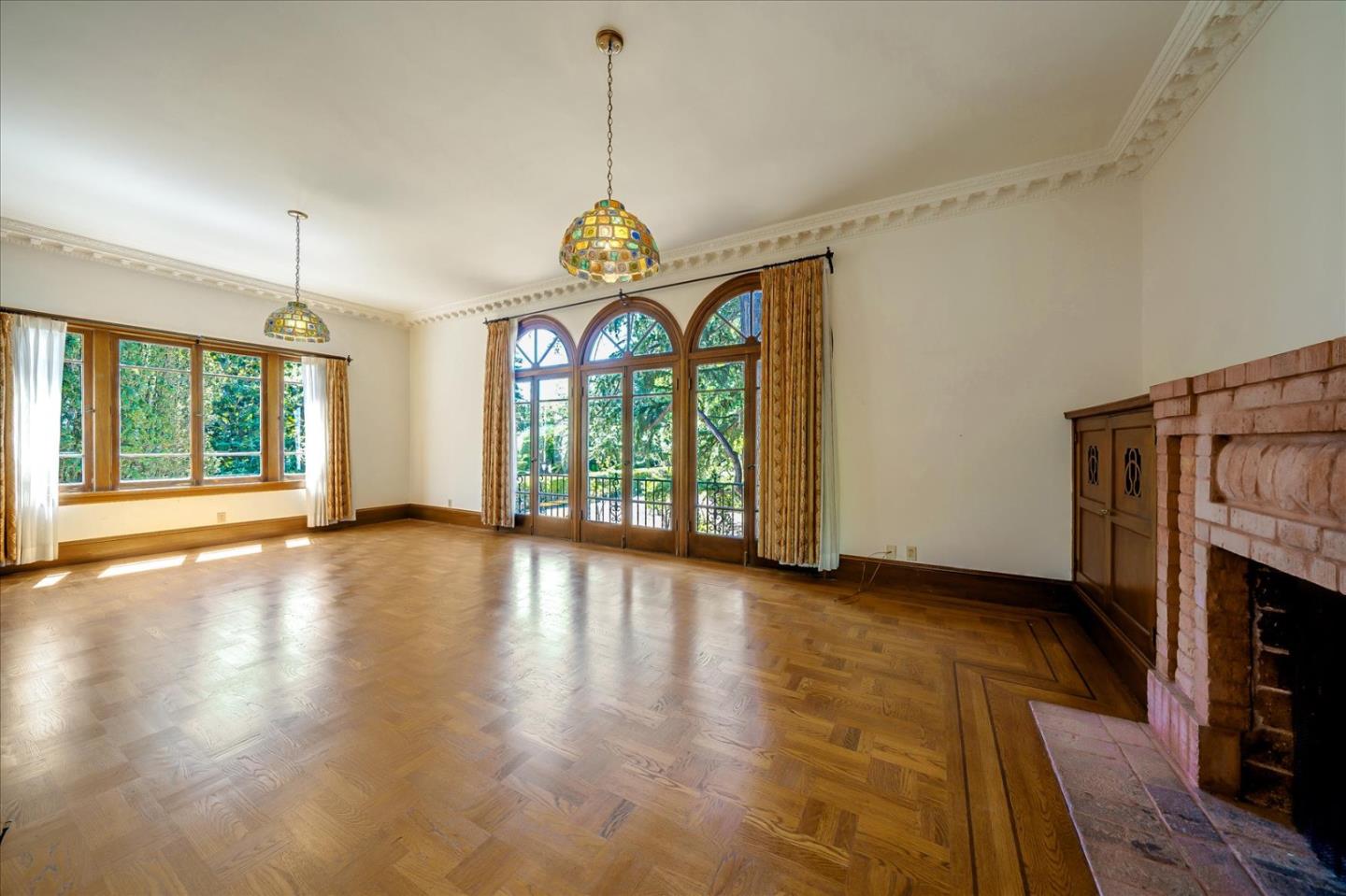 167 Almendral Avenue Atherton, CA 94027 - Photo 6 of 50 a view of an empty room with wooden floor and a window