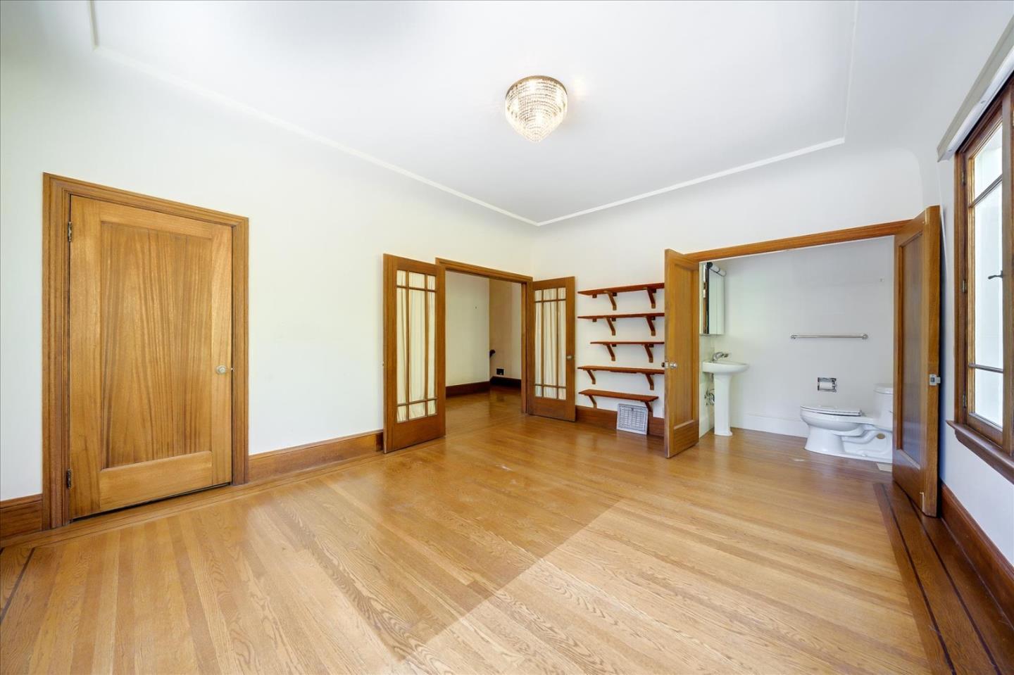 167 Almendral Avenue Atherton, CA 94027 - Photo 8 of 50 a view of a room with wooden floor and closet
