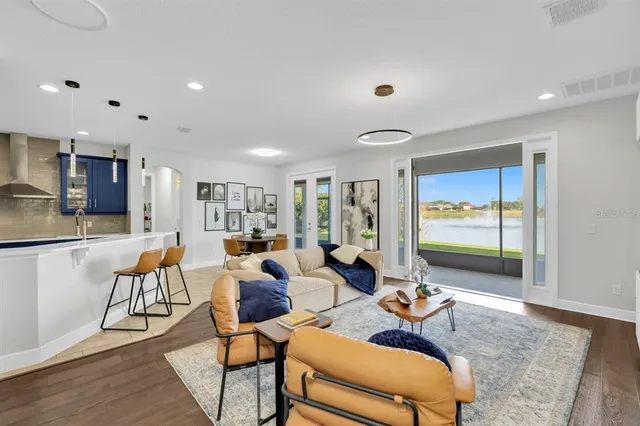 a view of a dining room with furniture and wooden floor