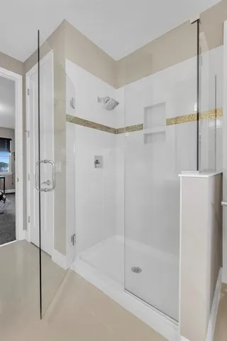 a bedroom with bed and a window