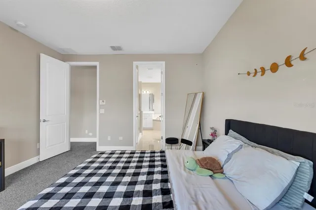 a view of a lake with houses in the back