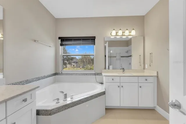 an aerial view of a house with a lake view