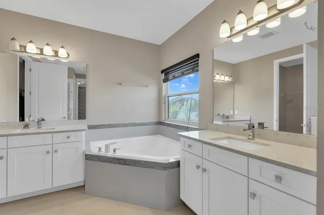 a view of house with swimming pool and outdoor seating