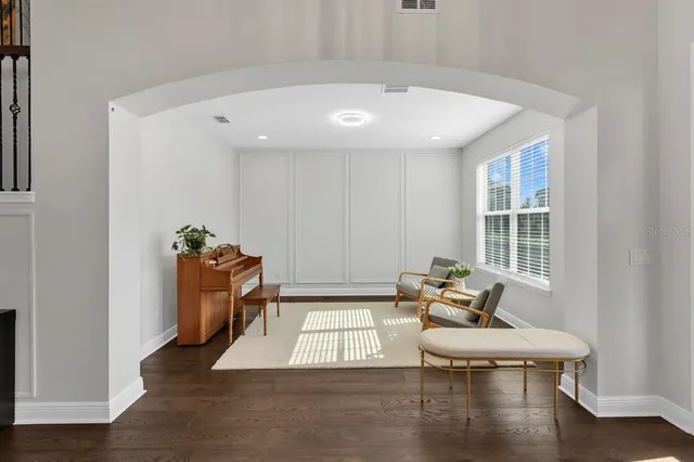 a living room with furniture and a window