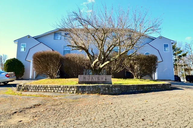 a view of a street with a building in the background